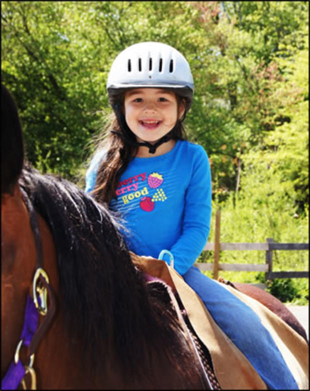 3/16/12 – Family &amp; Pets – Top Spots in Baltimore for Horseback Riding – little girl with helmet on horse 