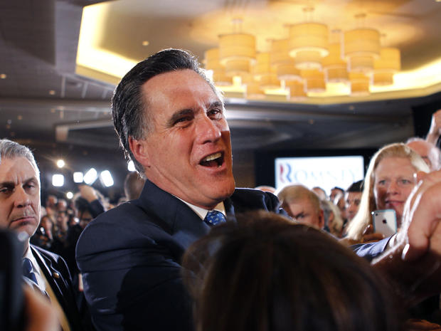 Mitt Romney greets supporters at his election night party in Boston 