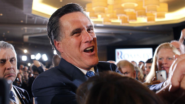 Mitt Romney greets supporters at his election night party in Boston 