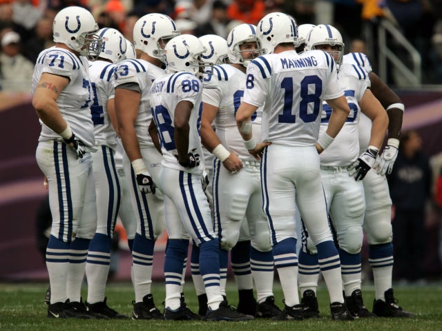 Peyton Manning of the Indianapolis Colts leads a huddle  