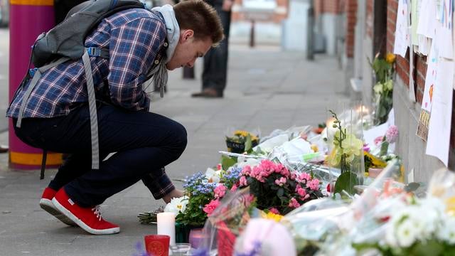Wreckage of a tourist bus from Belgium is dragged by a tow truck outside a motorway tunnel 