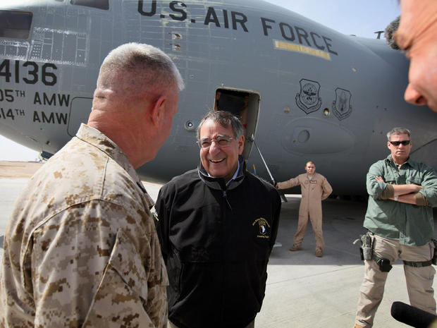 Defense Secretary Leon Panetta is greeted upon his arrival at Camp Bastion 