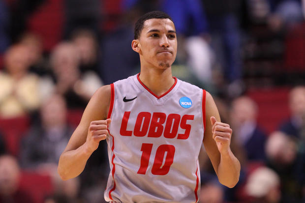 Kendall Williams reacts after the Lobos defeat the Long Beach State 49ers  