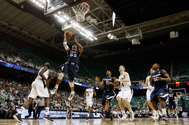 Tu Holloway  drives to the basket against Notre Dame  