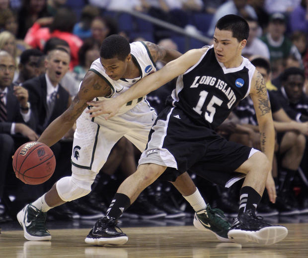 Keith Appling steals the ball from Long Island's Jason Brickman  