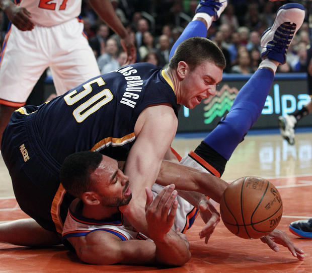 Tyler Hansbrough (50) and New York Knicks' Jared Jeffries fight for control of the ball  