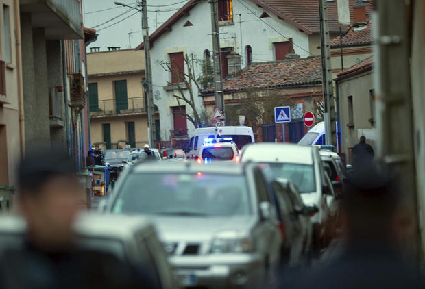 French police secure the area where they exchanged fire 