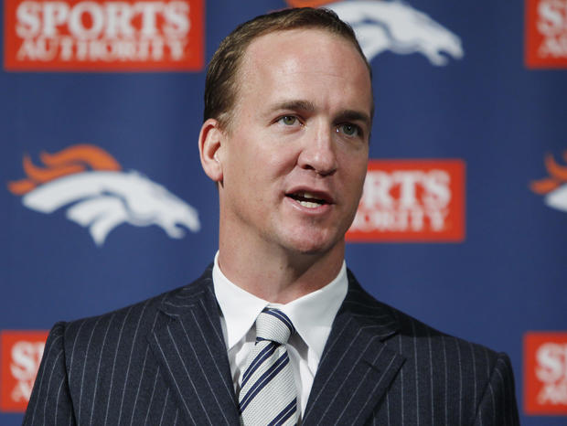 Peyton Manning speaks during a news conference 