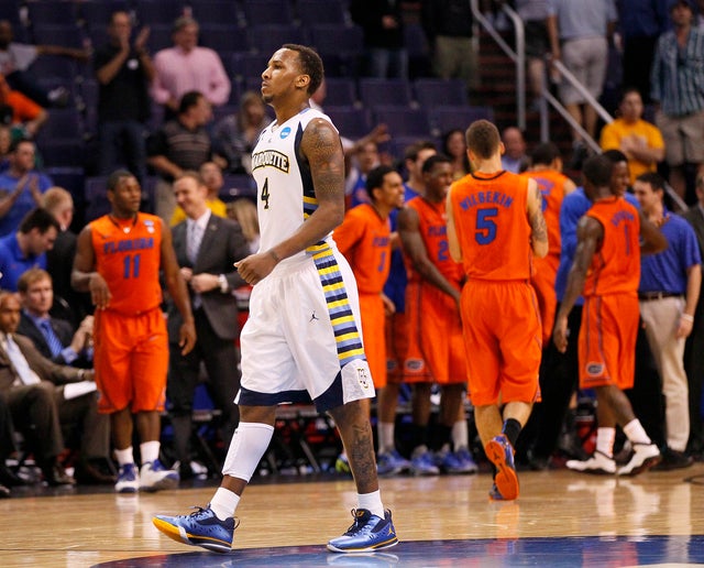 Todd Mayo walks off the court after his team lost  