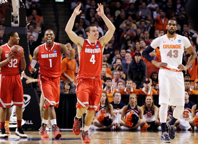 Aaron Craft reacts alongside Deshaun Thomas  
