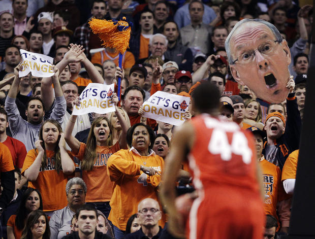 fans use a large photo of Syracuse head coach Jim Boeheim to taunt Ohio State guard William Buford 