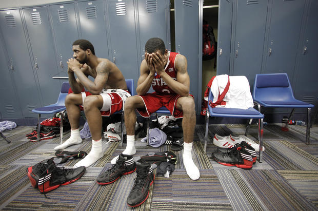 Richard Howell, left, and Lorenzo Brown reacts in the locker room 