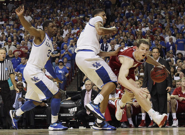Indiana's Victor Oladipo (4) works against Kentucky's Terrence Jones (3) and Kentucky's Anthony Davis  