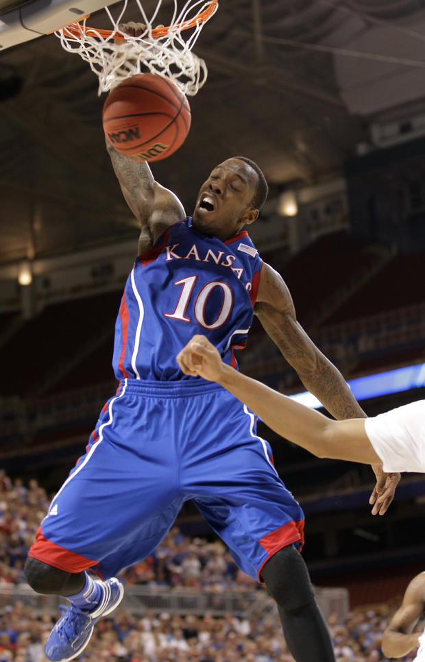 Tyshawn Taylor dunks during the second half 