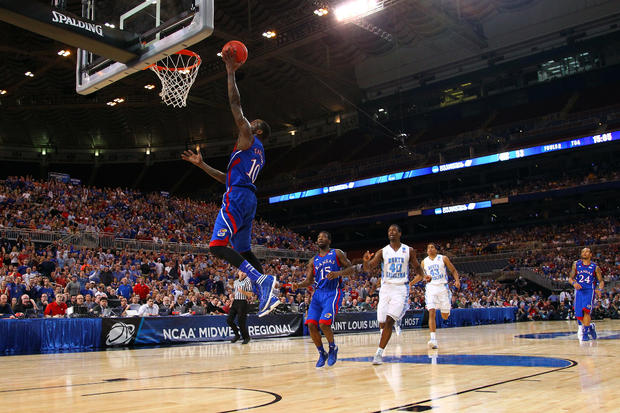 Tyshawn Taylor drives for a shot  