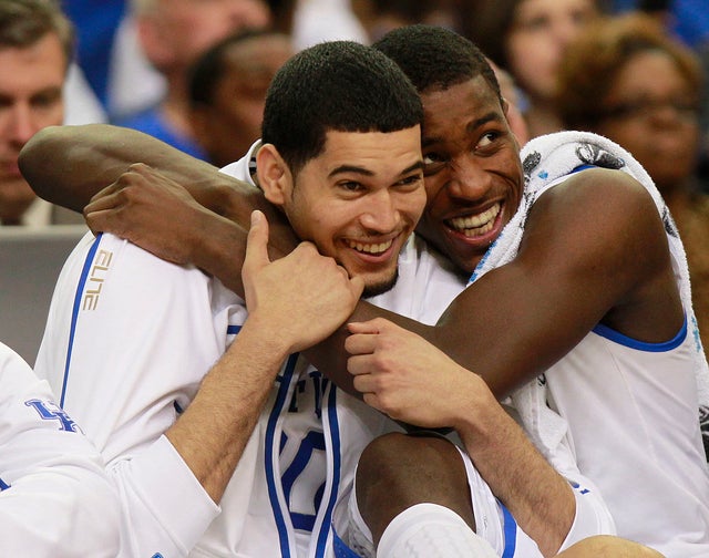 Eloy Vargas, left and Darius Miller reacts in the closing seconds 