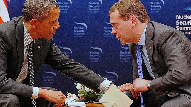 President Obama speaks to Russian President Dmitry Medvedev during a bilateral meeting in Seoul 