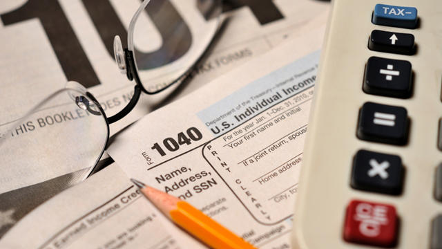 IRS Form 1040 and tax preparation materials 