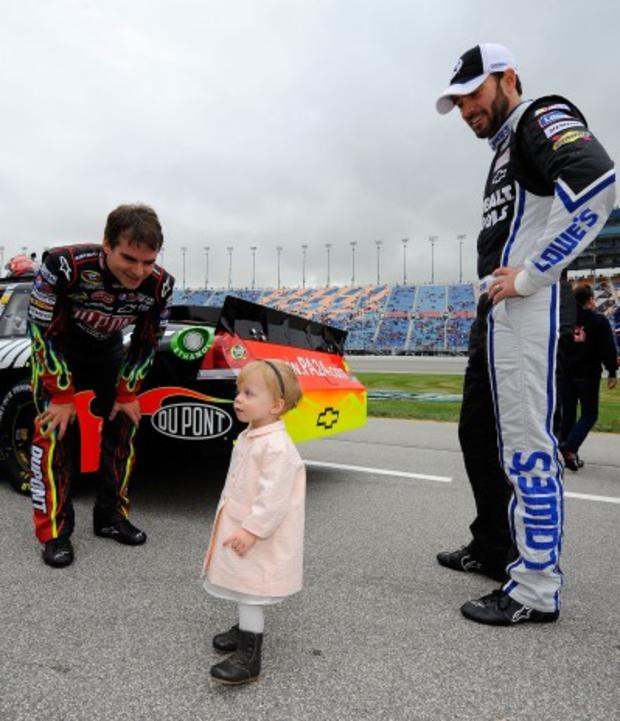 h-jeff-gordon-l-driver-of-the-24-dupont-chevrolet-and-jimmie-johnson-r-driver-of-the-48-lowes-kobalt-tools-chevrolet-look-at-jimmies-daughter-genevieve-marie.jpg 