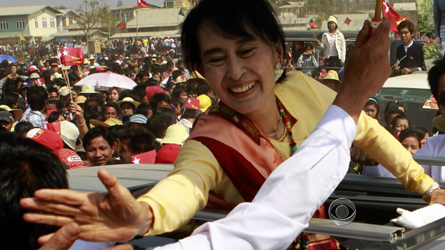 Burma pro-democracy icon Aung San Suu Kyi, right in front, accepts candidate list of her National League for Democracy at Yangon District Elections Commission Office for upcoming elections Monday, Feb. 6, 2012 in Yangon, Burma.  