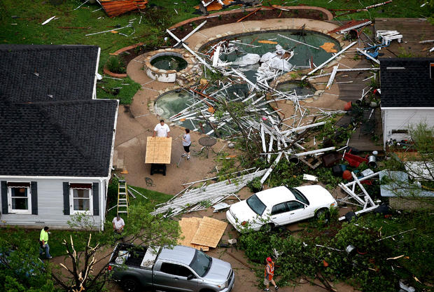 Residents clean up after a tornado hit in Arlington, Texas 