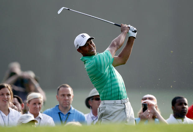 Tiger Woods hits a tee shot 
