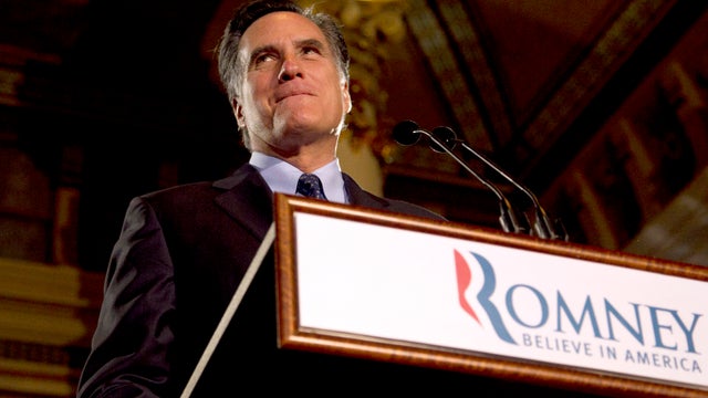 Gov. Mitt Romney pauses while speaking at a primary election night rally 