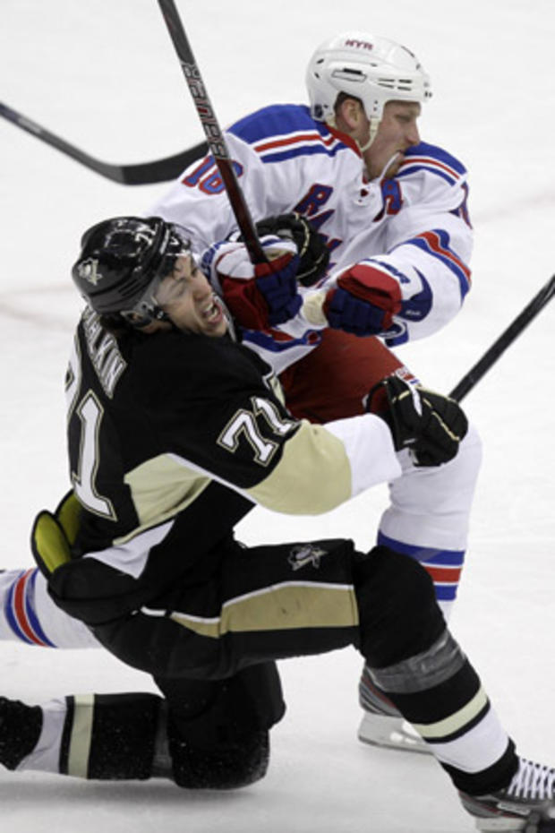 Evgeni Malkin collides with Marc Staal 