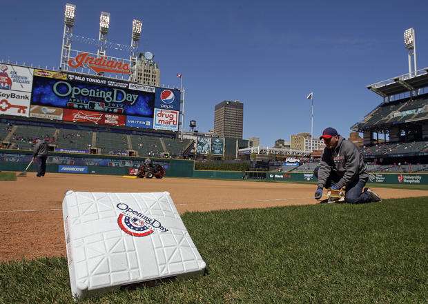 The Progressive Field grounds crew prepares the field for the opening day baseball game 