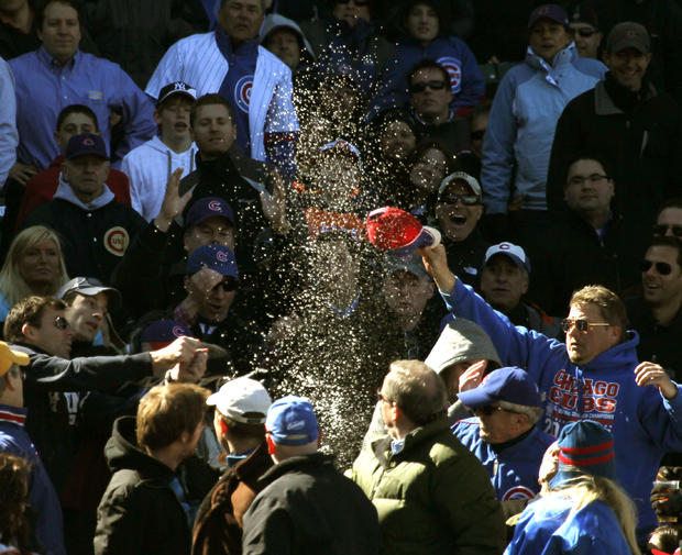 Baseball fans react after a foul ball hit by Chicago Cubs' Ian Stewart 