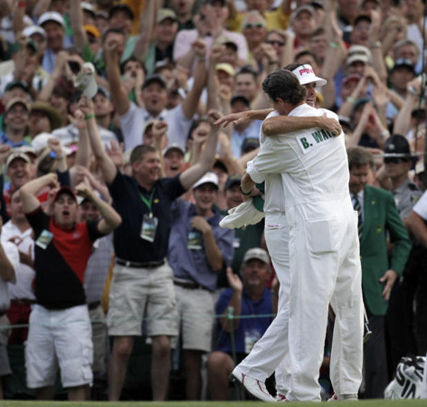 Bubba Watson hugs his caddie Ted Scott after winning the Masters golf tournament  