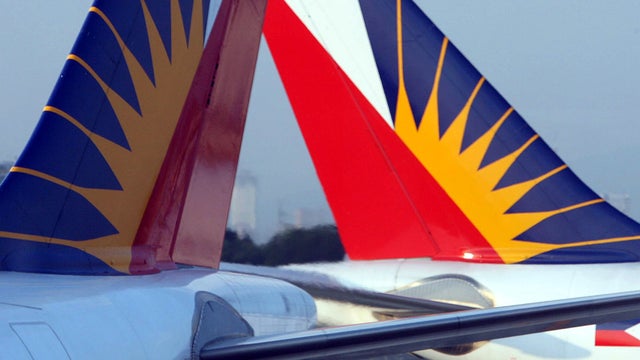 Philippine Airlines planes are parked at Ninoy Aquino international airport in Manila, Philippines, March 3, 2007. 