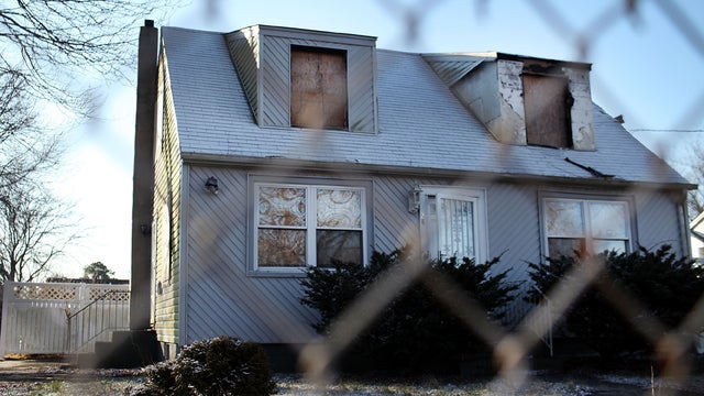 A foreclosed home stands boarded up Feb. 9, 2012, in Islip, N.Y. 