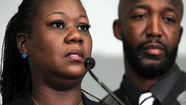Trayvon Martin's mother, Sybrina Fulton, speaks as father Tracy Martin listens during a news conference April 11, 2012, in Washington about their son, who was fatally shot by neighborhood watch captain George Zimmerman in Florida. 