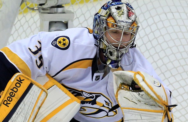 Predators goalie Pekka Rinne makes a glove-save during the third period 