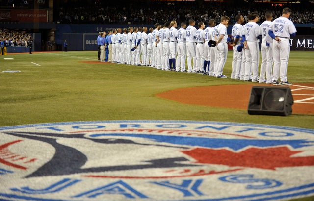 Toronto Blue Jays stand on the third base 