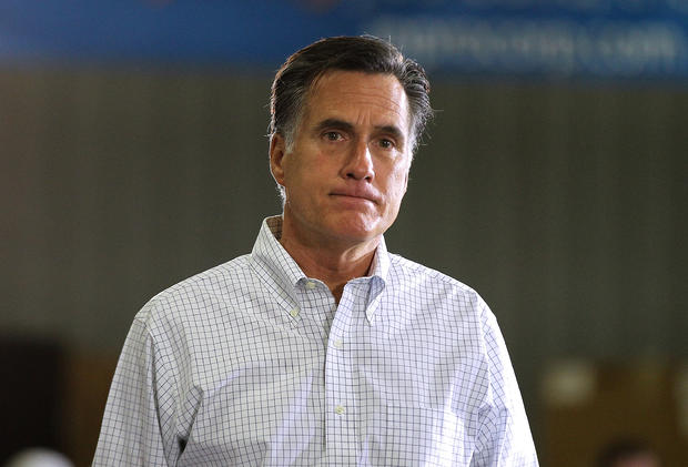 Mitt Romney pauses as he speaks during a town hall style meeting 