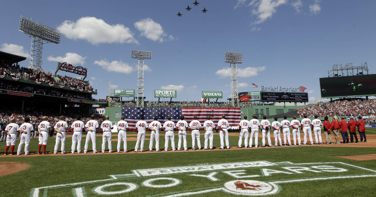 Baseball fans stand during the singing of the National Anthem before the  start of a baseball game between the Miami Marlins and the St. Louis  Cardinals, Wednesday, June 12, 2019, in Miami. (