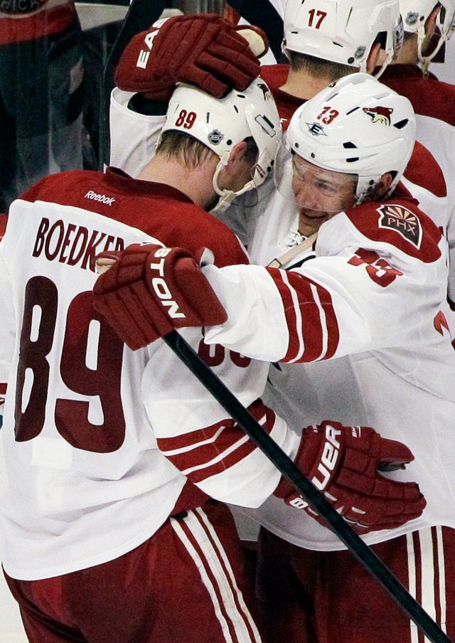 Ray Whitney celebrates with Mikkel Boedker 