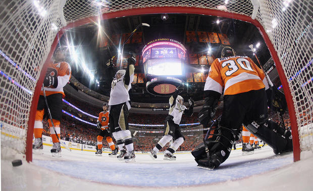 Chris Kunitz (14) and Evgeni Malkin (71) of the Pittsburgh Penguins celebrate a powerplay goal by Kris Letang 