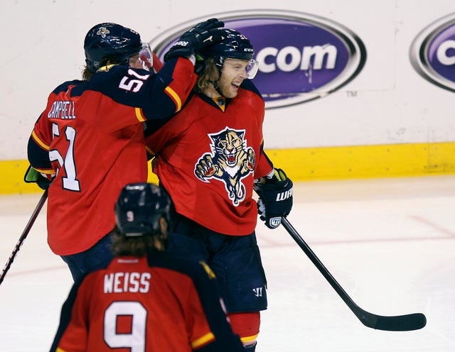 Brian Campbell  celebrates with Kris Versteeg scored the first goal of the game 