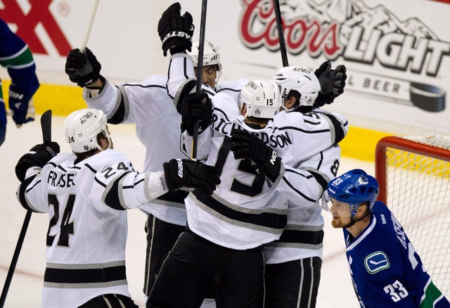 Kings' Colin Fraser, from left, Rob Scuderi, Brad Richardson and Drew Doughty celebrate Richardson's goal 