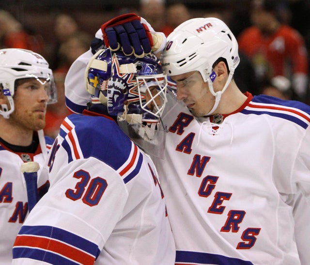 Chris Kreider celebrates with goaltender Henrik Lundquist 