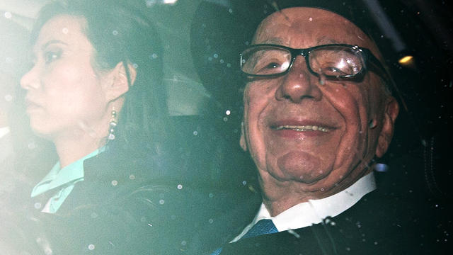 News Corp. chief Rupert Murdoch, accompanied by his wife Wendi Deng, leaves their London home April 25, 2012, to testify before Parliament. 