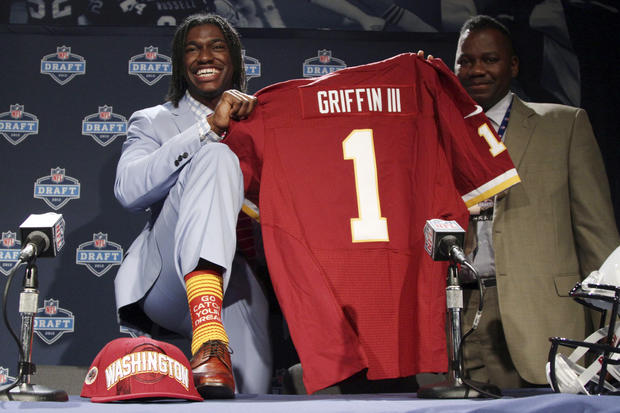Robert Griffin III, left, is joined by his father Robert Griffin Jr. 