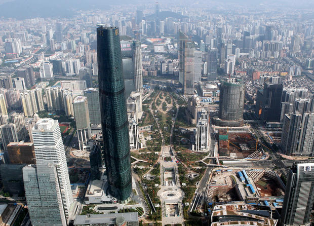 File photo shows aerial view of the Guangzhou International Finance Center (IFC) and other modern buildings in Guangzhou in October 2010 