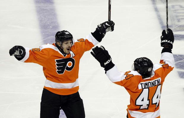 Danny Briere reacts with Kimmo Timonen after scored the winning goal in the overtime period 