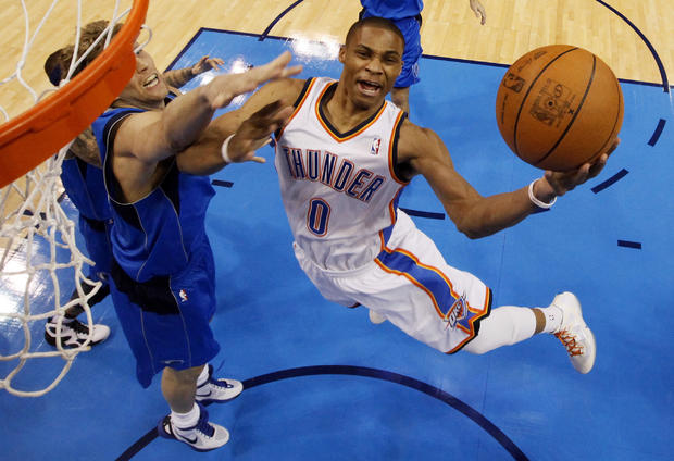 Russell Westbrook takes the ball to the hoop  