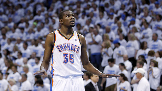 Kevin Durant gestures to the crowd  