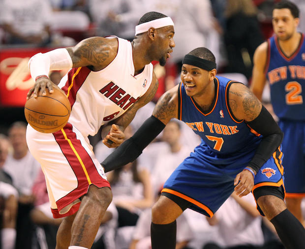 LeBron James drives against Carmelo Anthony 